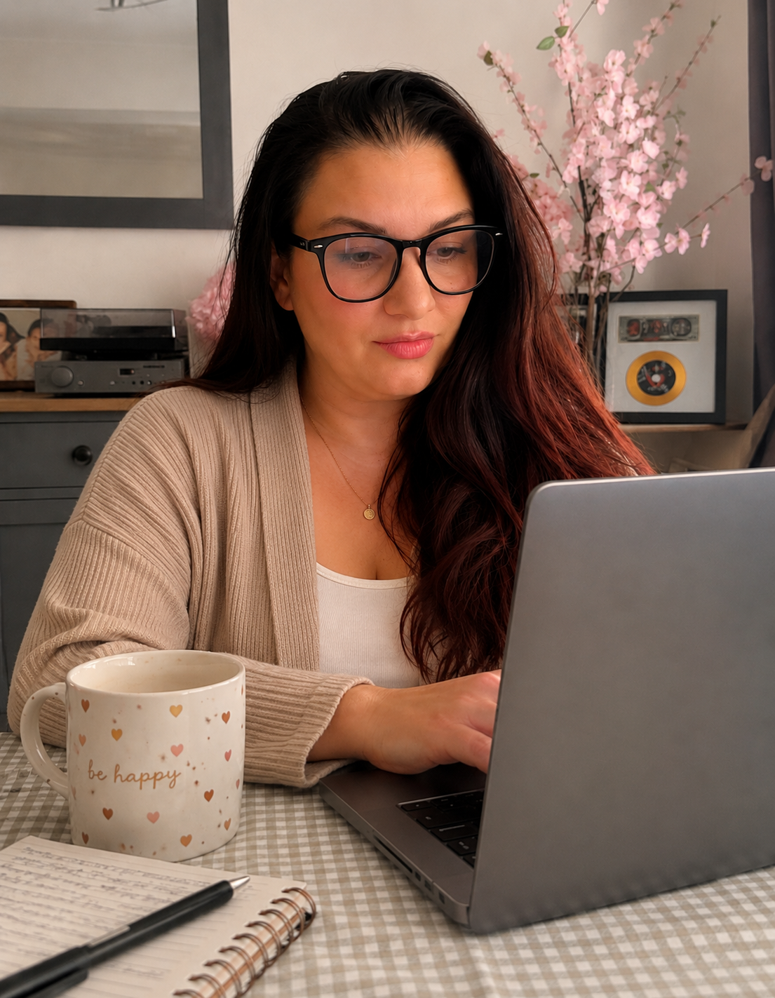 Laura from Digital Wealth Made Simple working at her laptop at home.